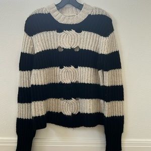Thakoon size S black and cream striped sweater with cut outs.